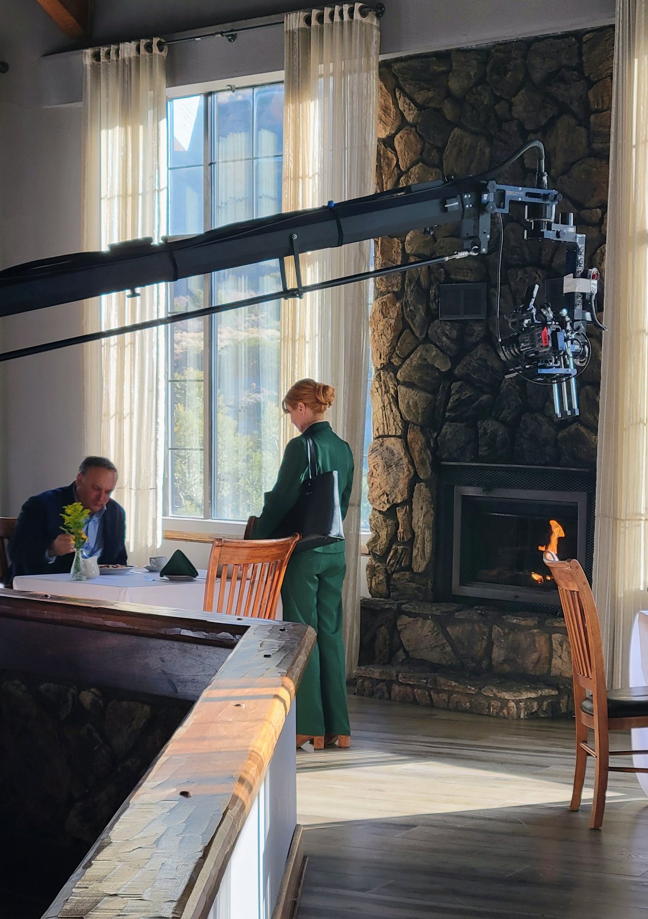 Camera crane and actors on a production set